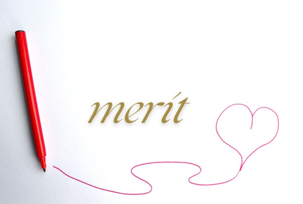 白い背景に赤ペンでハートが書いてある、meritの文字の画像